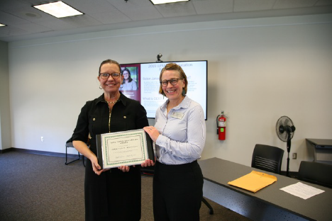 Jennifer Mahoney holds IUPUI Open Education Award certificate with Dean Kristi Palmer